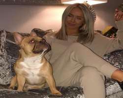 Kelly has also adopted a furry baby and loves to spend her free time with him.